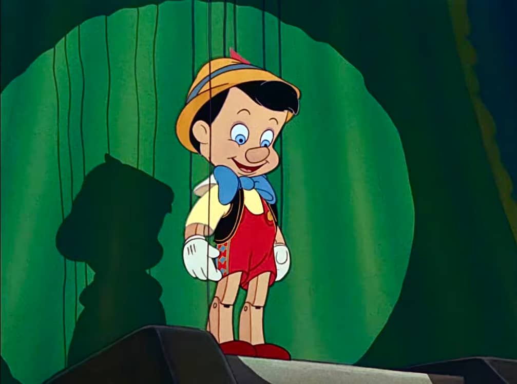 Pinocchio about to put on a show & sing "I've Got No strings on me"